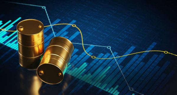 Abstract financial charts on a digital display and two golden oil drums on it, as symbol of oil, gasoline or fuels and lubricants.