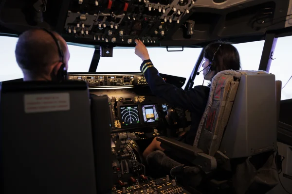 female-pilot-assisting-captain-takeoff-fly-airplane-using-buttons-dashboard-command-pilot-cockpit-airliners-flying-plane-jet-with-navigation-windscreen-control-panel